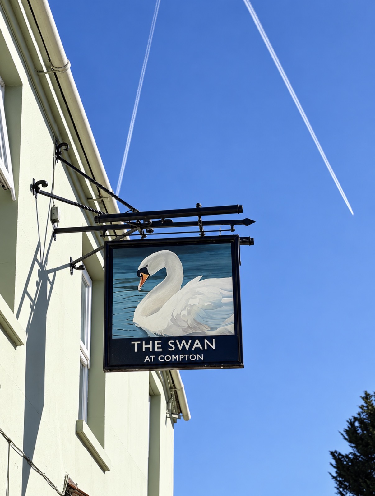 Hand-painted pub sign at The Swan at Compton